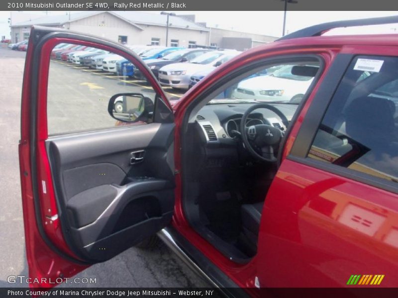 Rally Red Metallic / Black 2010 Mitsubishi Outlander SE 4WD