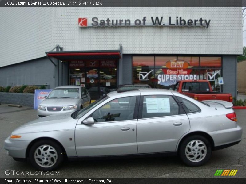 Bright Silver / Black 2002 Saturn L Series L200 Sedan