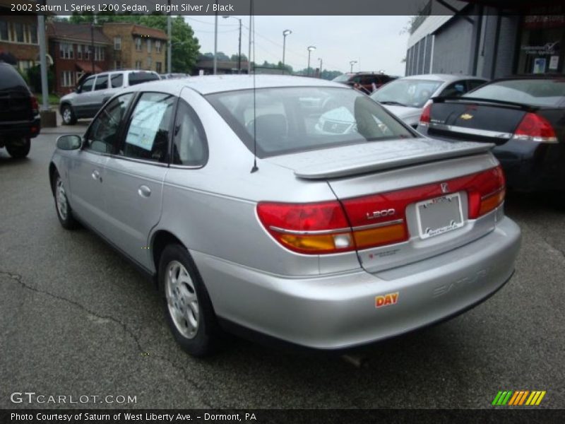 Bright Silver / Black 2002 Saturn L Series L200 Sedan