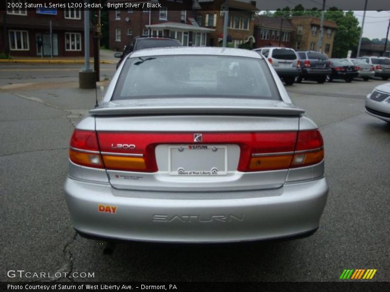 Bright Silver / Black 2002 Saturn L Series L200 Sedan