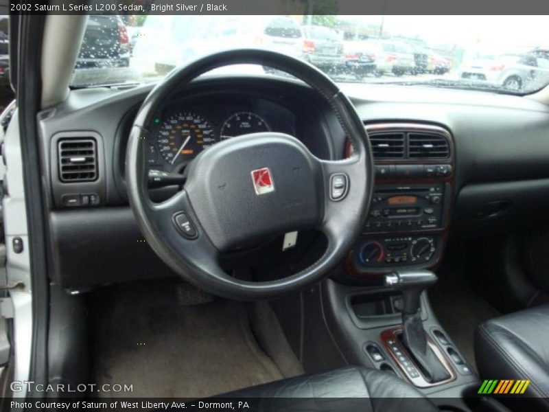 Bright Silver / Black 2002 Saturn L Series L200 Sedan