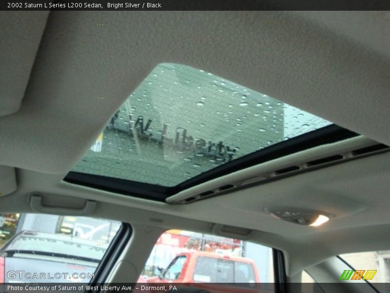 Bright Silver / Black 2002 Saturn L Series L200 Sedan
