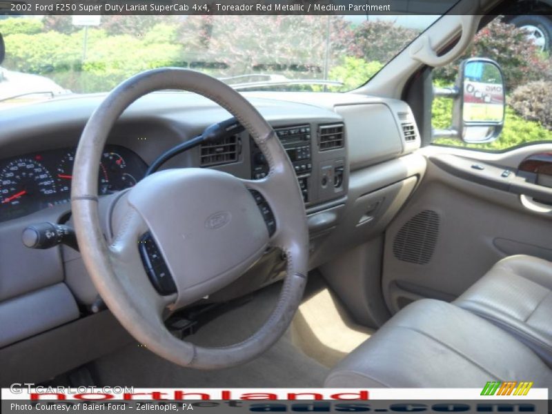 Toreador Red Metallic / Medium Parchment 2002 Ford F250 Super Duty Lariat SuperCab 4x4