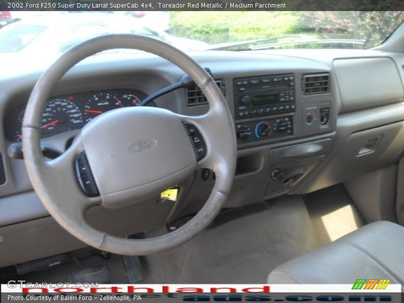 Toreador Red Metallic / Medium Parchment 2002 Ford F250 Super Duty Lariat SuperCab 4x4