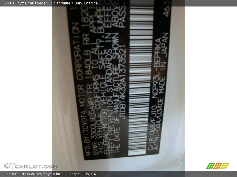 Polar White / Dark Charcoal 2010 Toyota Yaris Sedan