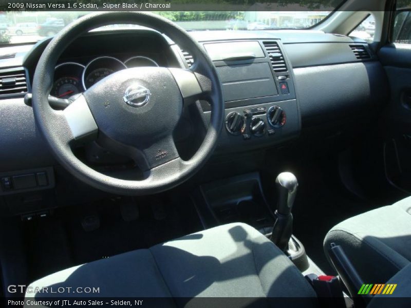 Super Black / Charcoal 2009 Nissan Versa 1.6 Sedan