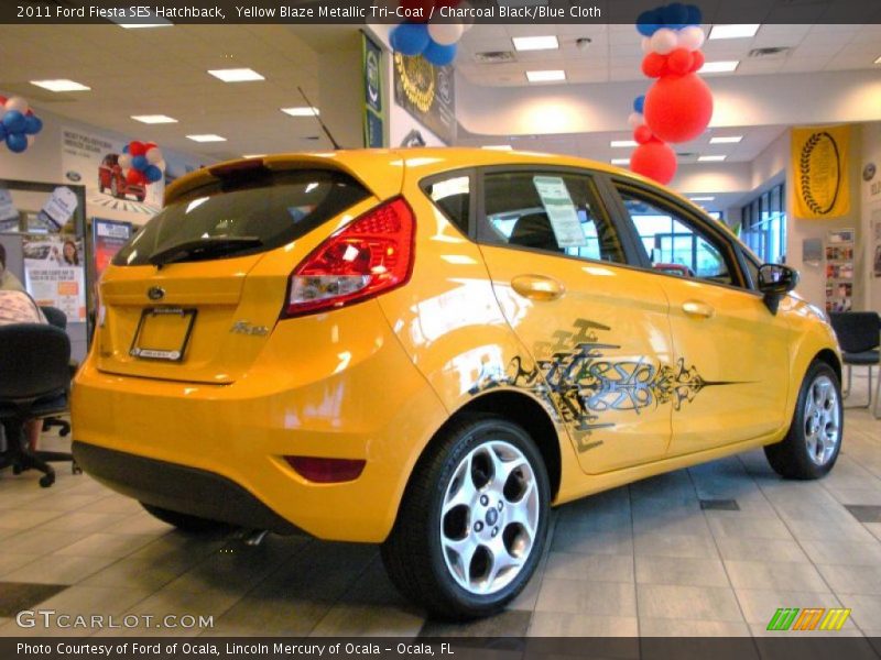 Yellow Blaze Metallic Tri-Coat / Charcoal Black/Blue Cloth 2011 Ford Fiesta SES Hatchback