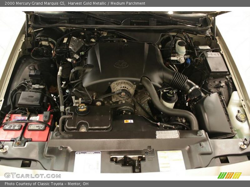 Harvest Gold Metallic / Medium Parchment 2000 Mercury Grand Marquis GS