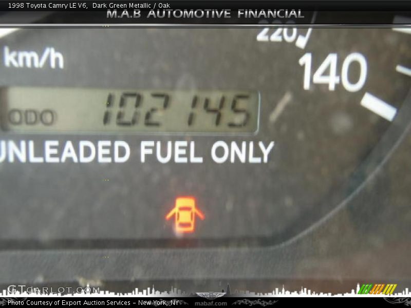 Dark Green Metallic / Oak 1998 Toyota Camry LE V6