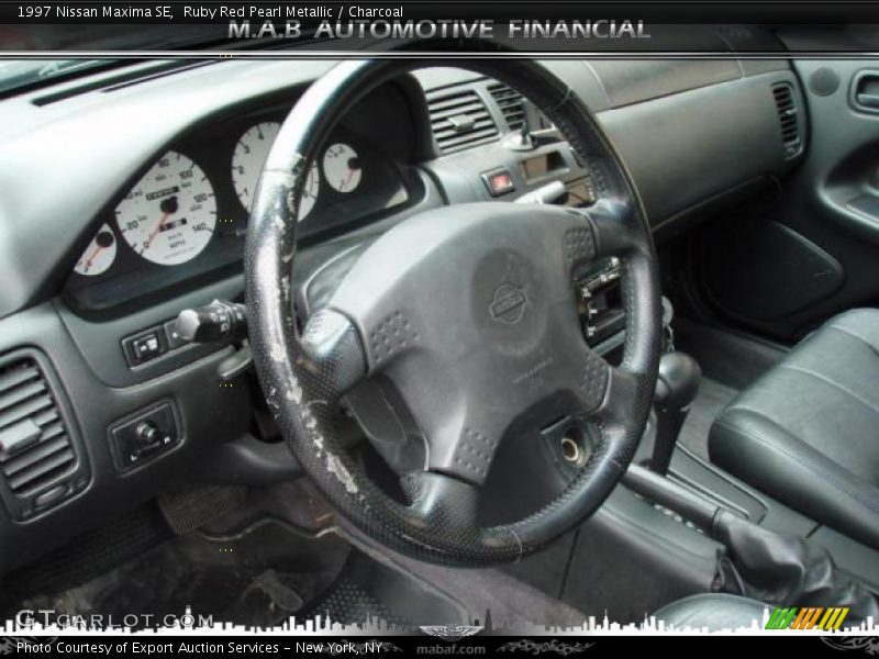 Ruby Red Pearl Metallic / Charcoal 1997 Nissan Maxima SE