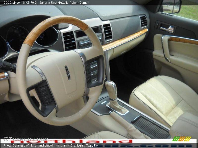 Sangria Red Metallic / Light Camel 2010 Lincoln MKZ FWD
