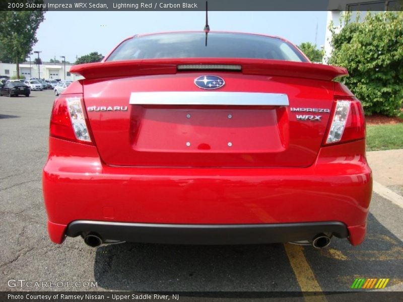 Lightning Red / Carbon Black 2009 Subaru Impreza WRX Sedan