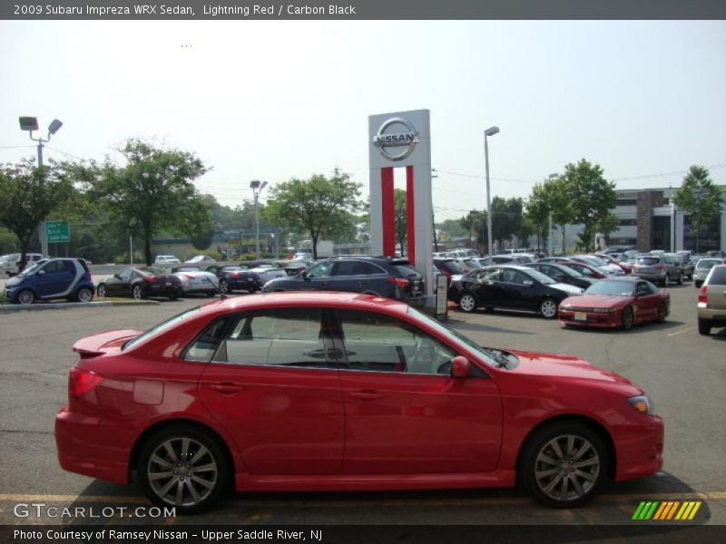 Lightning Red / Carbon Black 2009 Subaru Impreza WRX Sedan