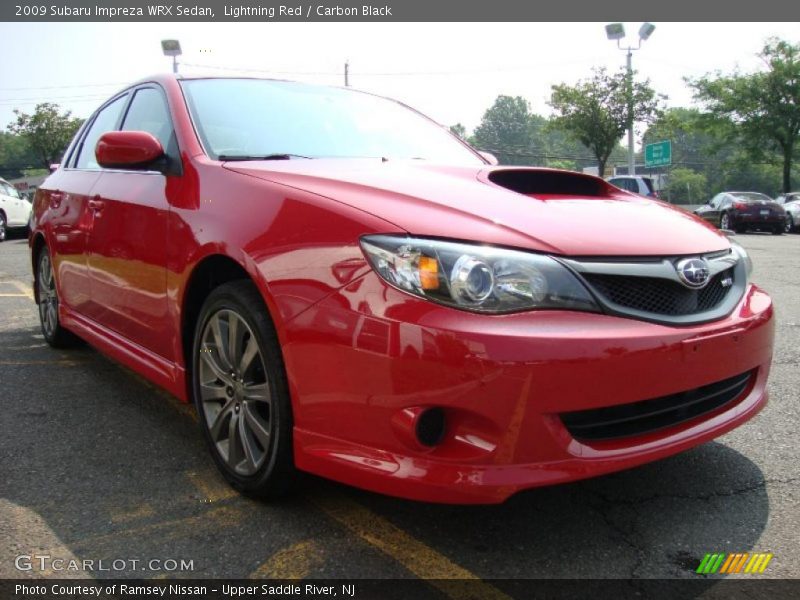 Lightning Red / Carbon Black 2009 Subaru Impreza WRX Sedan