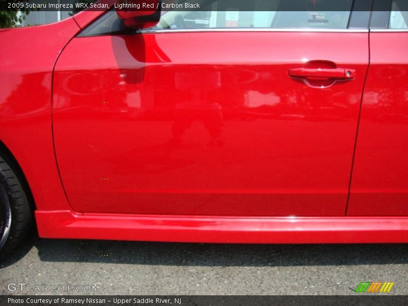 Lightning Red / Carbon Black 2009 Subaru Impreza WRX Sedan