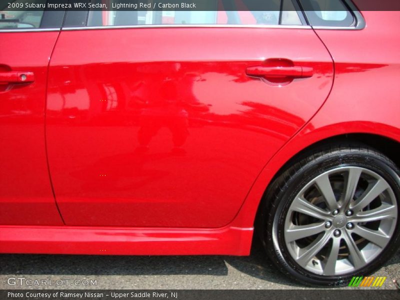 Lightning Red / Carbon Black 2009 Subaru Impreza WRX Sedan