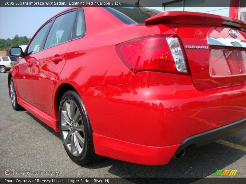 Lightning Red / Carbon Black 2009 Subaru Impreza WRX Sedan