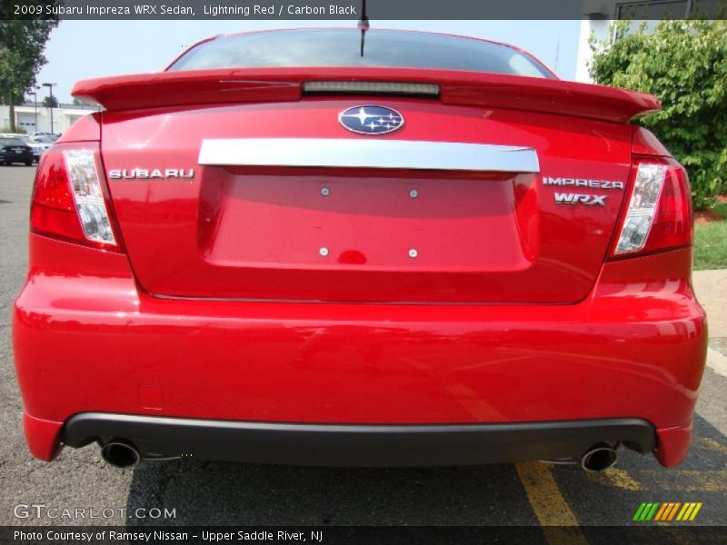 Lightning Red / Carbon Black 2009 Subaru Impreza WRX Sedan