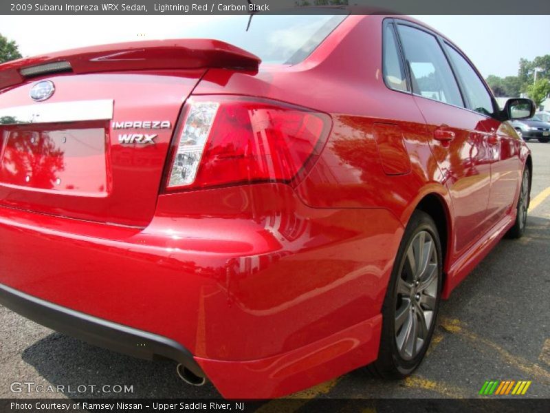 Lightning Red / Carbon Black 2009 Subaru Impreza WRX Sedan
