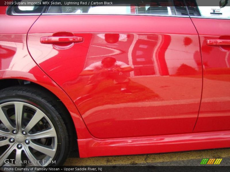 Lightning Red / Carbon Black 2009 Subaru Impreza WRX Sedan