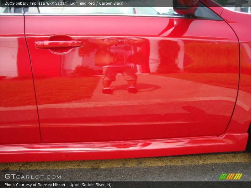 Lightning Red / Carbon Black 2009 Subaru Impreza WRX Sedan