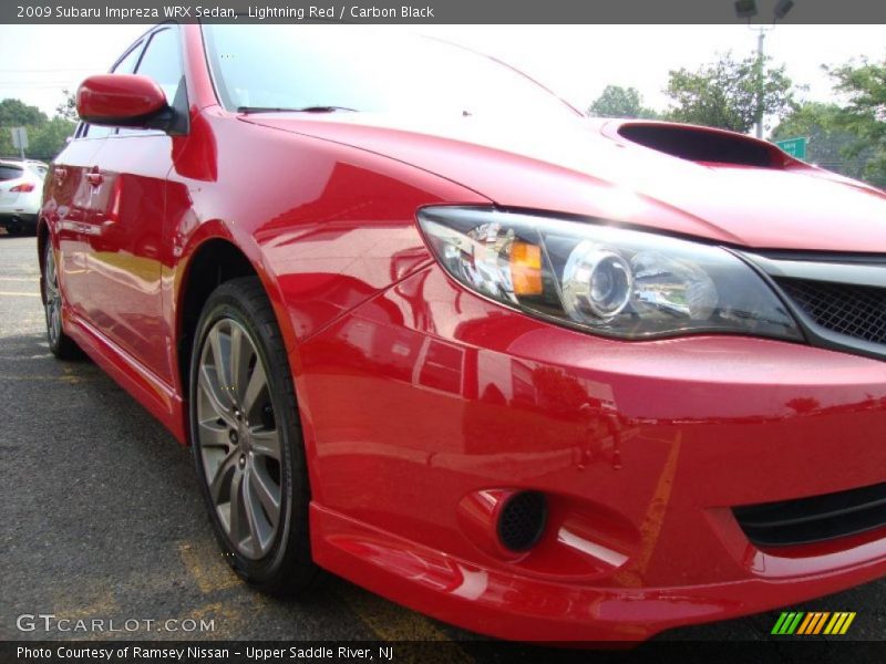 Lightning Red / Carbon Black 2009 Subaru Impreza WRX Sedan