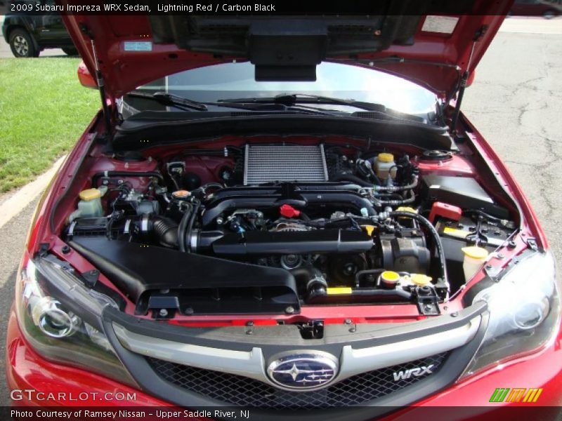 Lightning Red / Carbon Black 2009 Subaru Impreza WRX Sedan