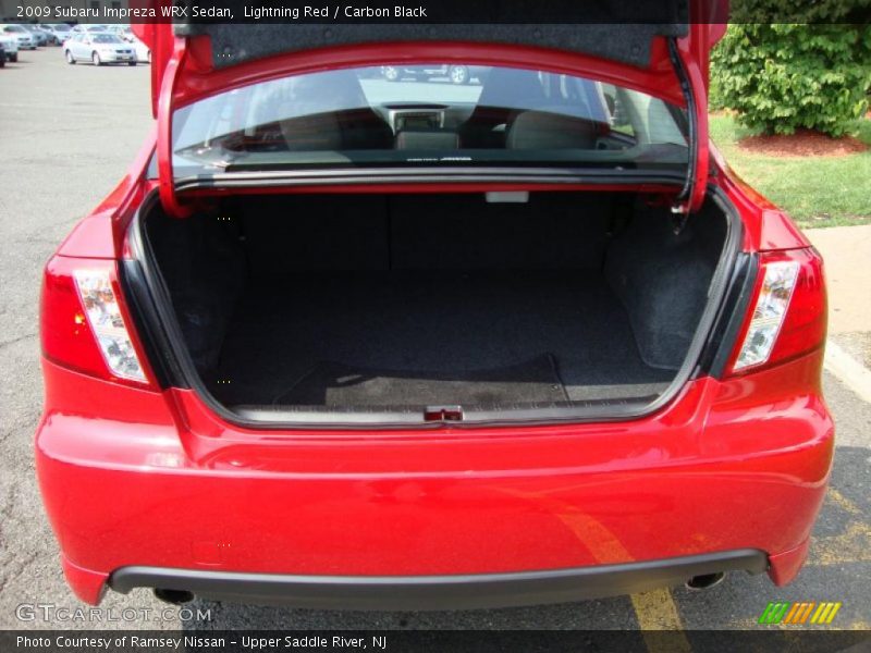 Lightning Red / Carbon Black 2009 Subaru Impreza WRX Sedan