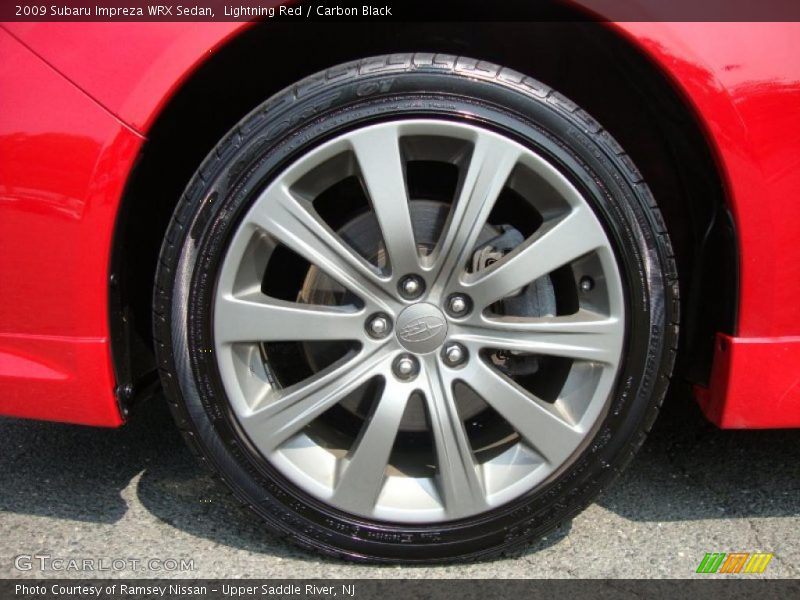 Lightning Red / Carbon Black 2009 Subaru Impreza WRX Sedan