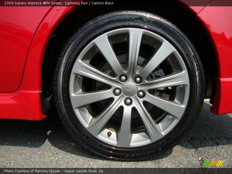 Lightning Red / Carbon Black 2009 Subaru Impreza WRX Sedan