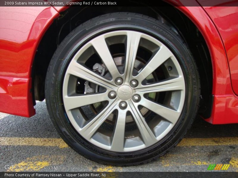 Lightning Red / Carbon Black 2009 Subaru Impreza WRX Sedan
