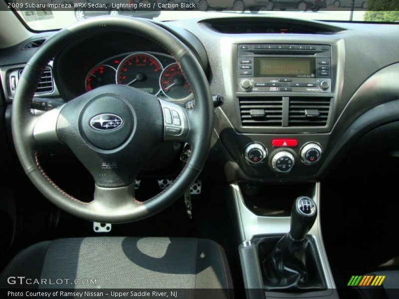 Lightning Red / Carbon Black 2009 Subaru Impreza WRX Sedan
