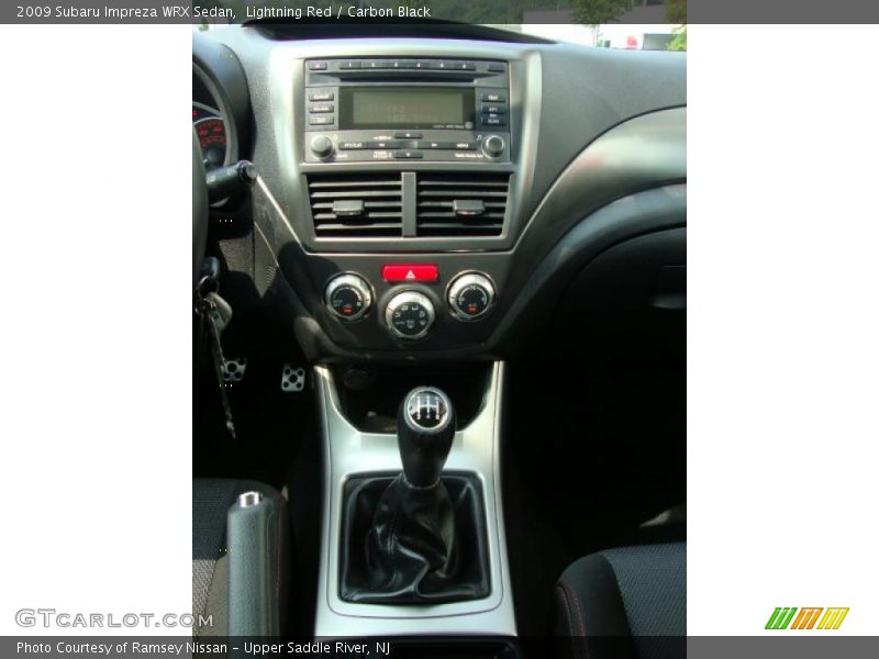Lightning Red / Carbon Black 2009 Subaru Impreza WRX Sedan