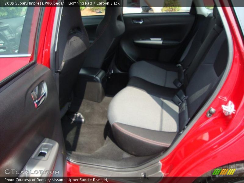 Lightning Red / Carbon Black 2009 Subaru Impreza WRX Sedan