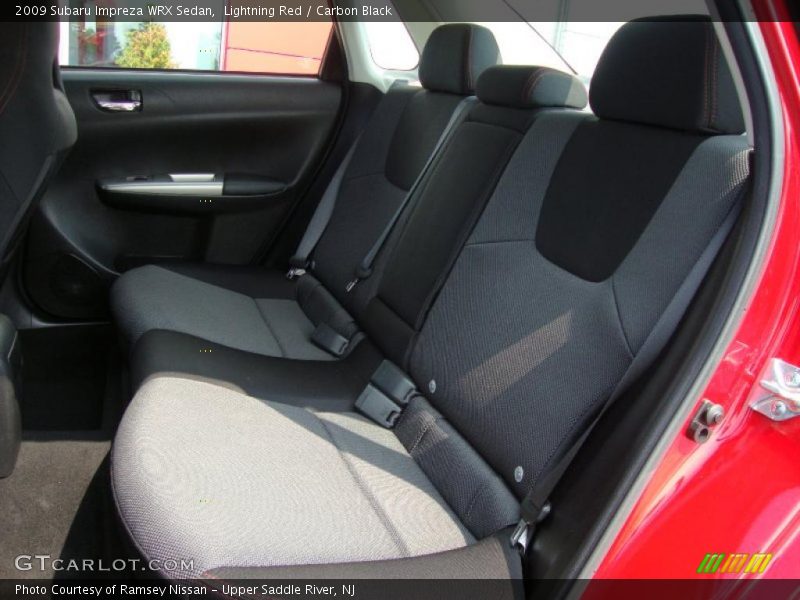 Lightning Red / Carbon Black 2009 Subaru Impreza WRX Sedan