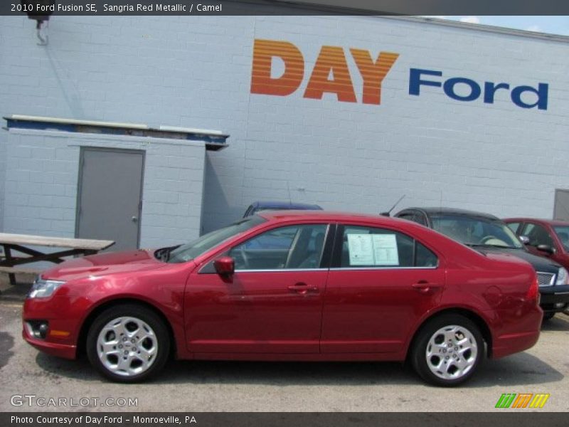Sangria Red Metallic / Camel 2010 Ford Fusion SE
