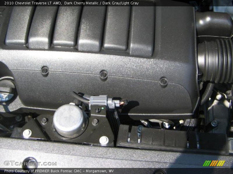 Dark Cherry Metallic / Dark Gray/Light Gray 2010 Chevrolet Traverse LT AWD