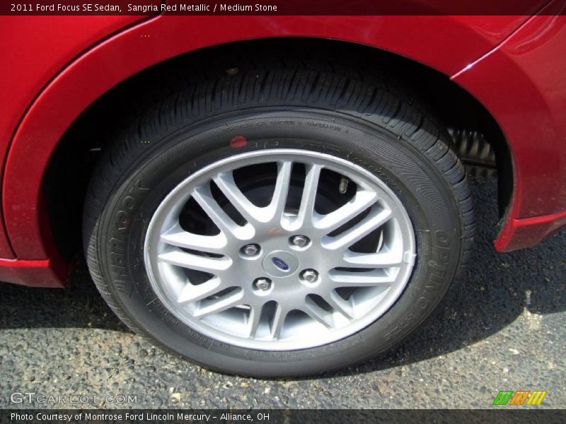 Sangria Red Metallic / Medium Stone 2011 Ford Focus SE Sedan