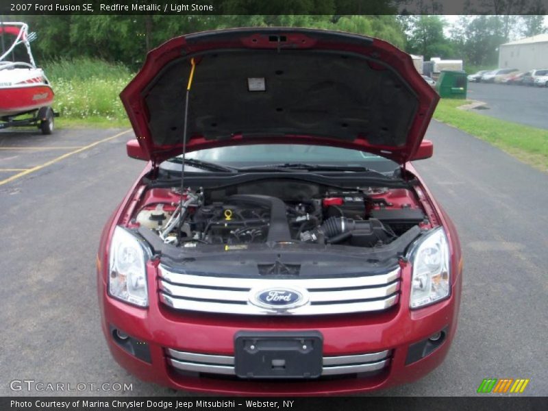 Redfire Metallic / Light Stone 2007 Ford Fusion SE
