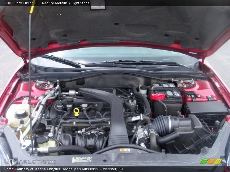 Redfire Metallic / Light Stone 2007 Ford Fusion SE