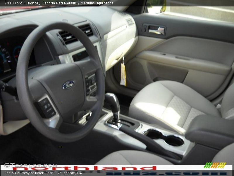 Sangria Red Metallic / Medium Light Stone 2010 Ford Fusion SE
