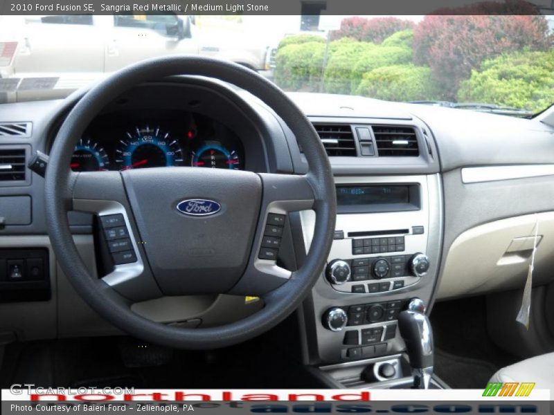Sangria Red Metallic / Medium Light Stone 2010 Ford Fusion SE
