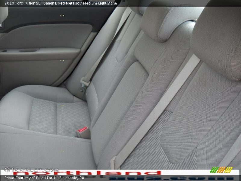 Sangria Red Metallic / Medium Light Stone 2010 Ford Fusion SE