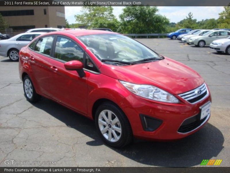 Red Candy Metallic / Light Stone/Charcoal Black Cloth 2011 Ford Fiesta SE Sedan