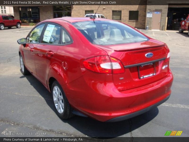 Red Candy Metallic / Light Stone/Charcoal Black Cloth 2011 Ford Fiesta SE Sedan