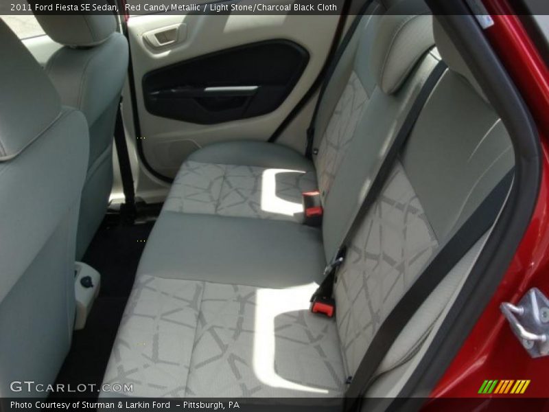 Red Candy Metallic / Light Stone/Charcoal Black Cloth 2011 Ford Fiesta SE Sedan