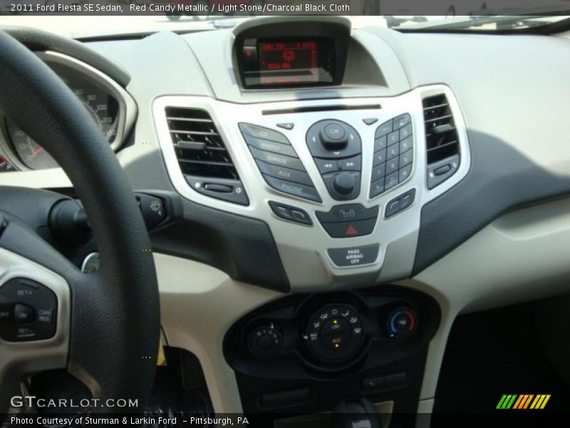 Red Candy Metallic / Light Stone/Charcoal Black Cloth 2011 Ford Fiesta SE Sedan
