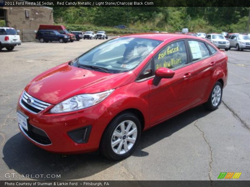 Red Candy Metallic / Light Stone/Charcoal Black Cloth 2011 Ford Fiesta SE Sedan