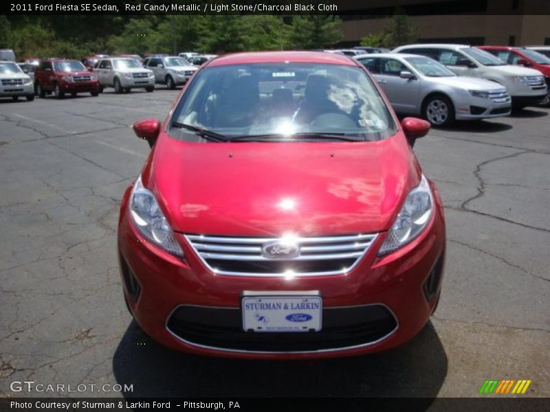 Red Candy Metallic / Light Stone/Charcoal Black Cloth 2011 Ford Fiesta SE Sedan