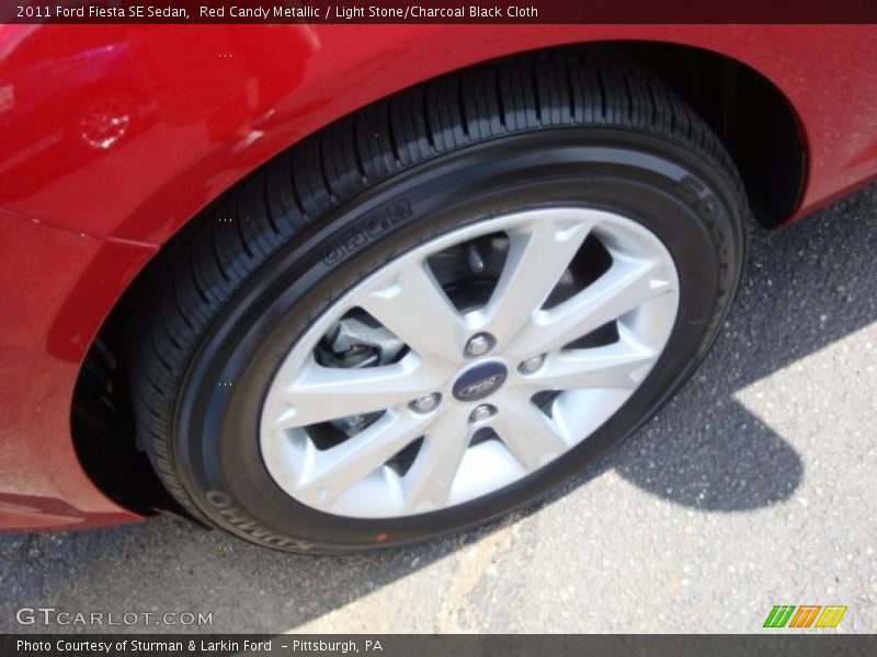 Red Candy Metallic / Light Stone/Charcoal Black Cloth 2011 Ford Fiesta SE Sedan